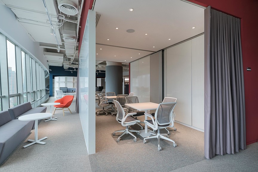 A room with tables and chairs.